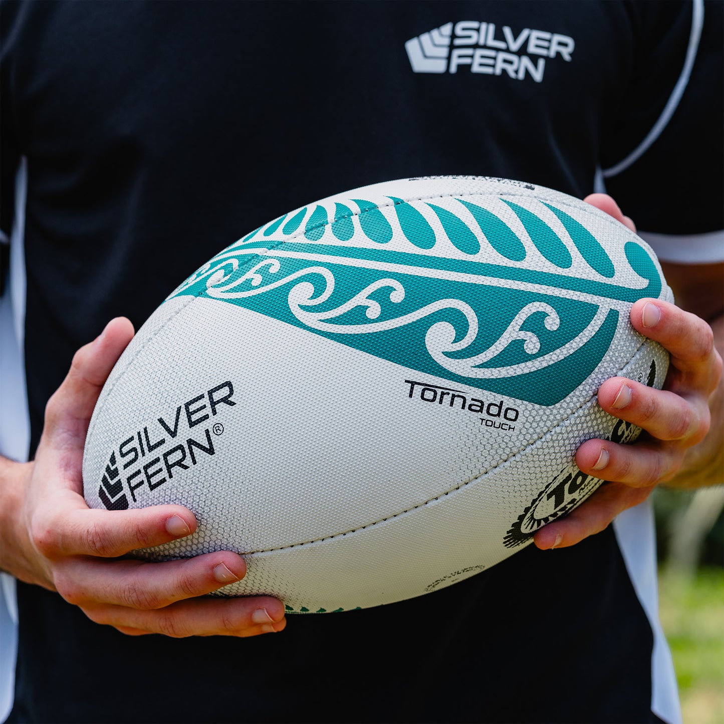 Green and White Tornado Match Touch Rugby Ball Lifestyle Image