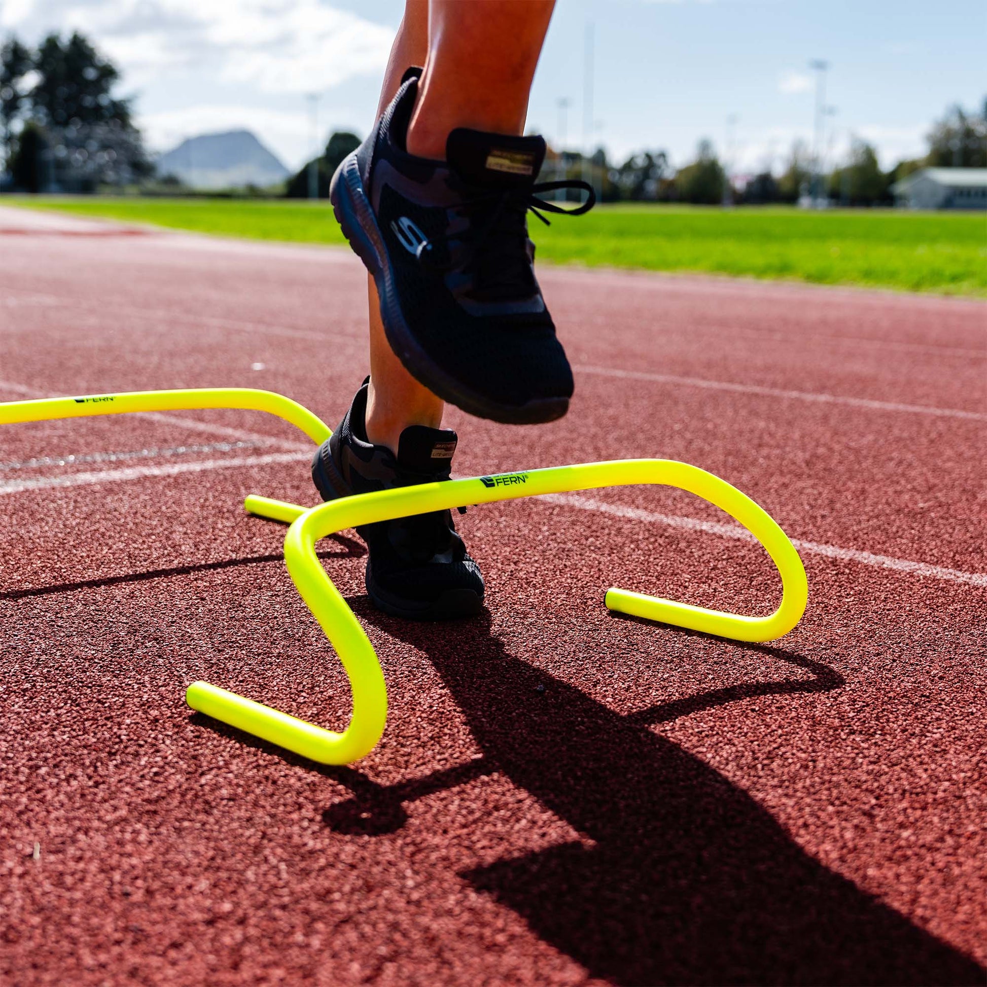 A set of 15 cm Agility Hurdles being used by an Athlete, lifestyle shot.