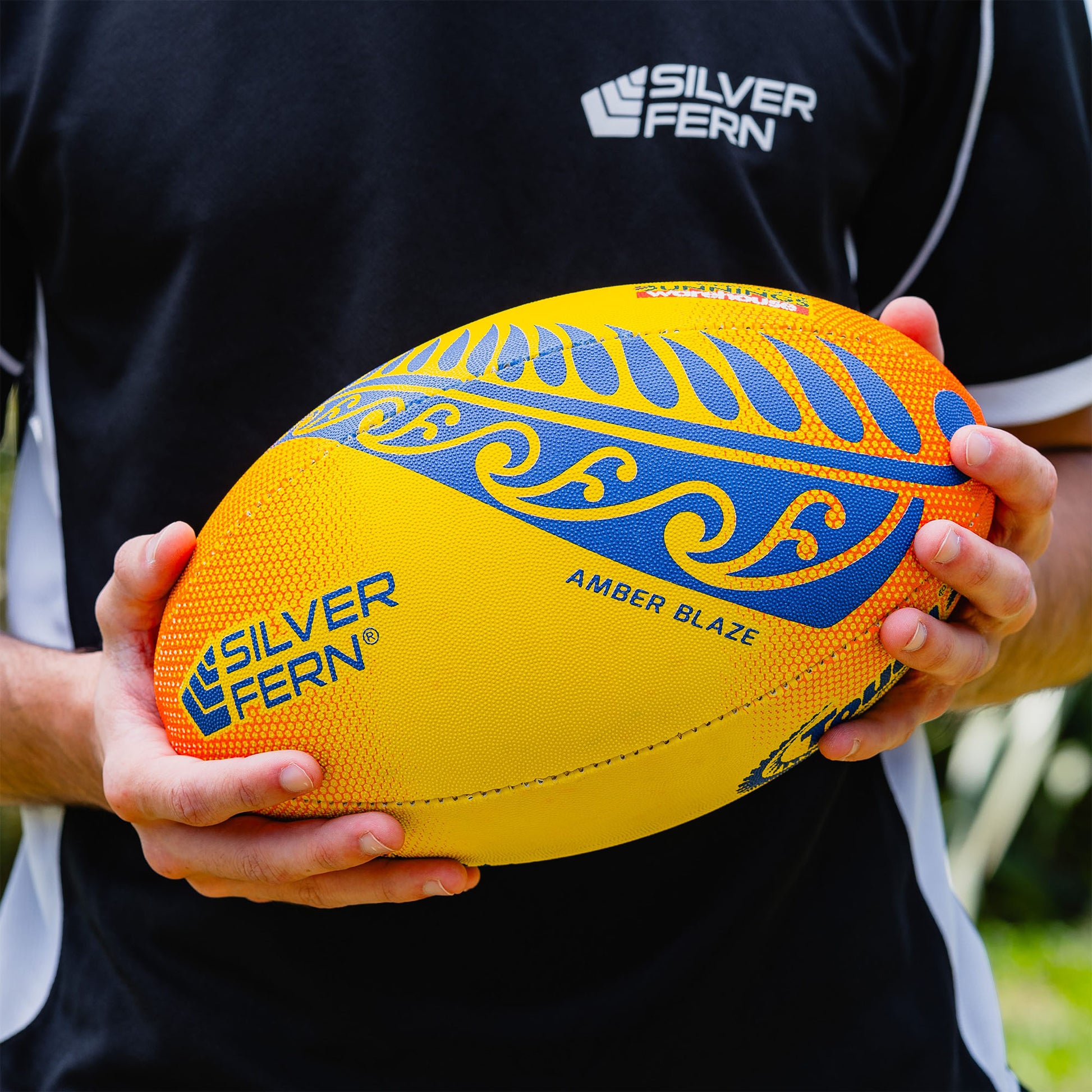 Amber Blaze Yellow and Orange Touch Rugby Ball Lifestyle Image