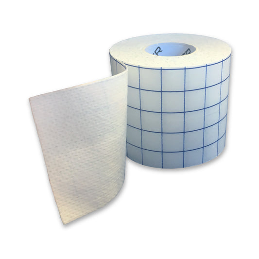 A roll of medical adhesive tape with a blue grid pattern on the backing paper, partially unrolled to show the white adhesive side. Hypofix.