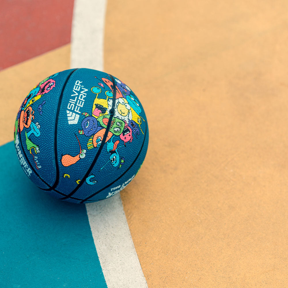 Colorful basketball with a cartoon design on a court