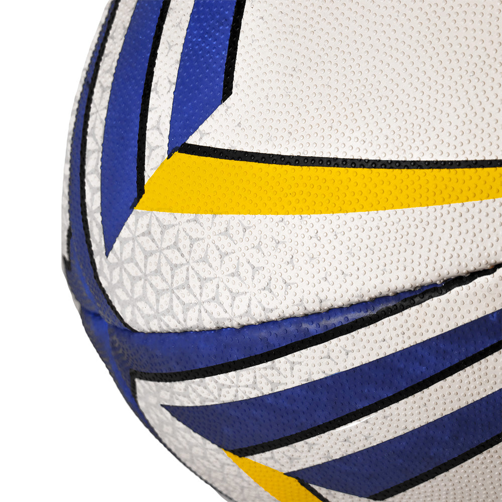 Close-up of a rugby ball with white, blue, and yellow patterns on a white background