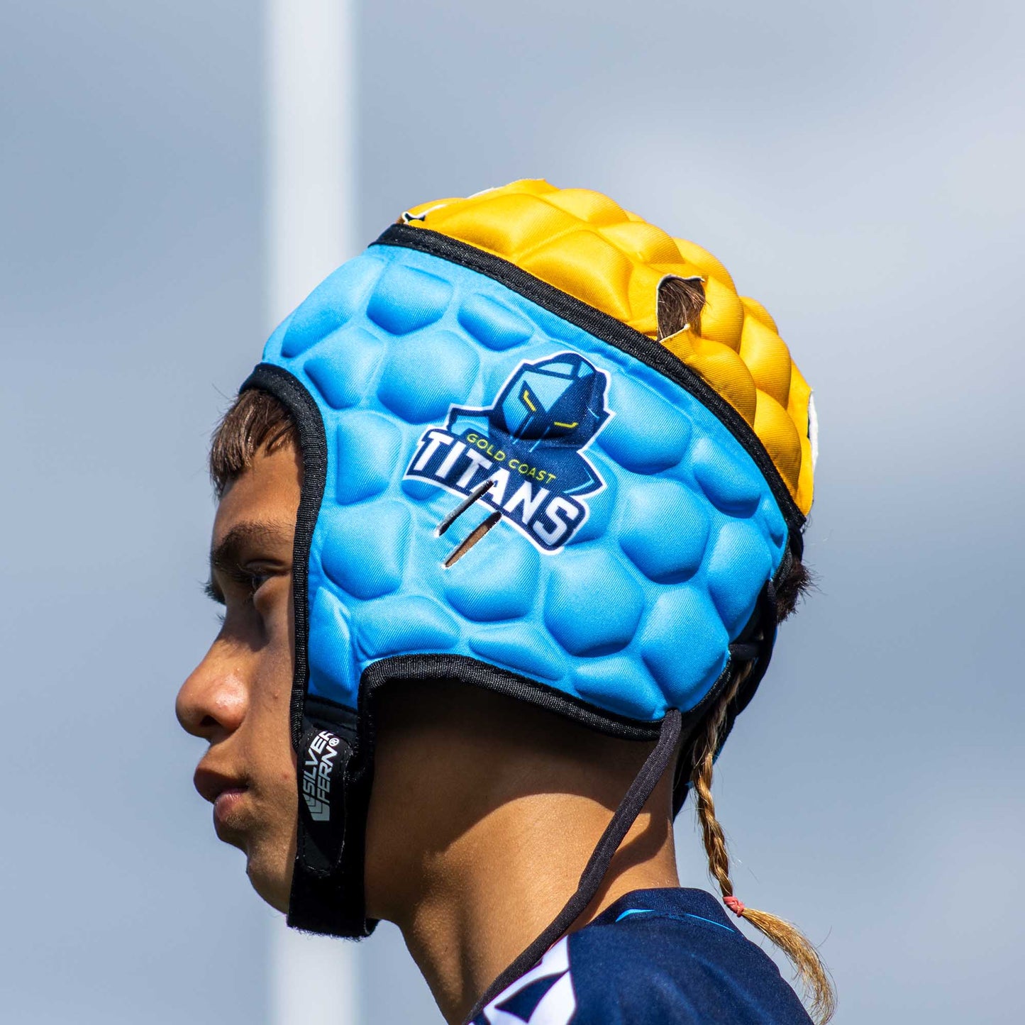 Official NRL Headgear, Gold Coast Titans, lifestyle image, side.