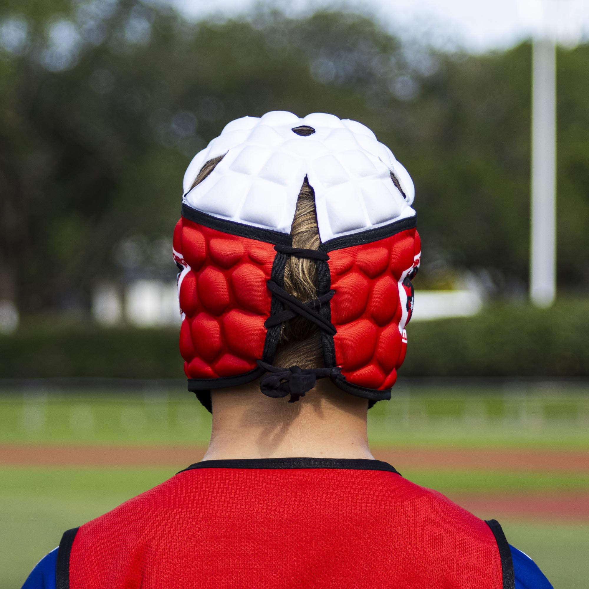 Official NRL Headgear, St. George Illawarra Dragons, lifestyle image, back.