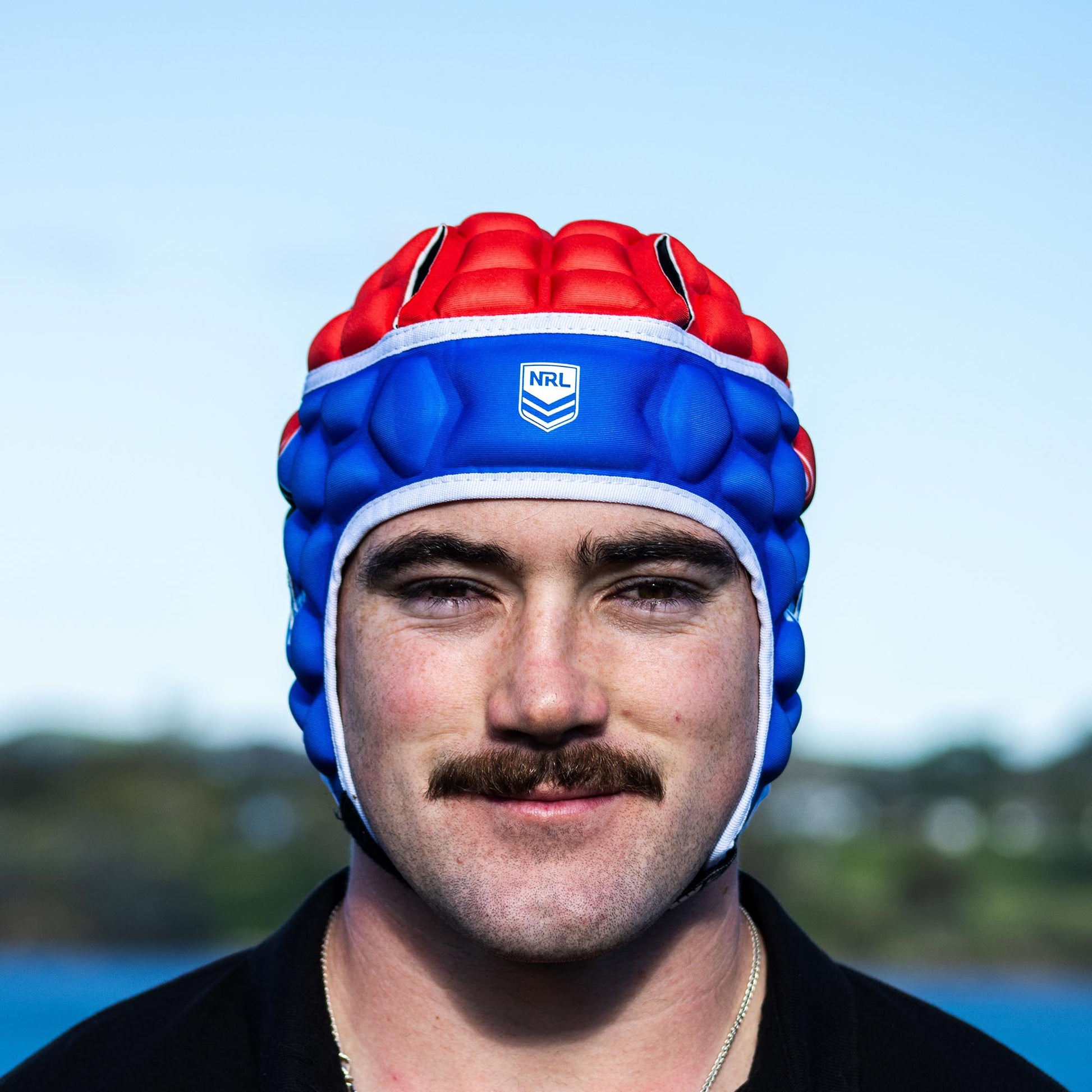 Official NRL Headgear, Newcastle Knights, lifestyle image, front.