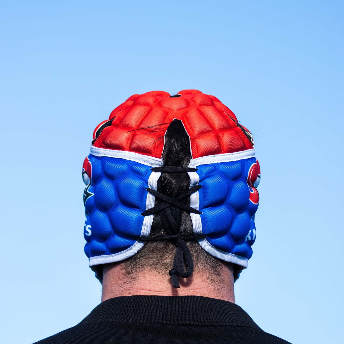 Official NRL Headgear, Newcastle Knights, lifestyle image, back.