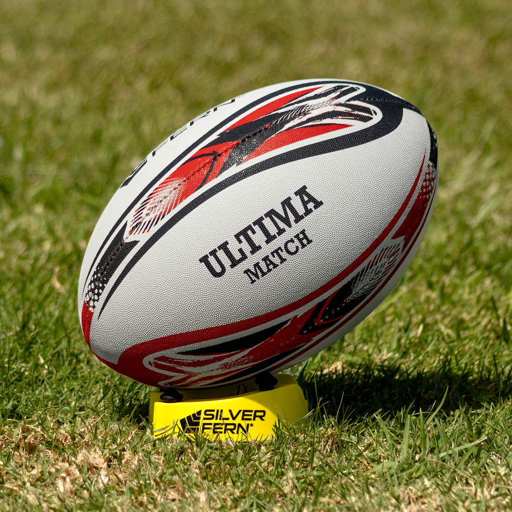 Silver Fern League Ultima Premium Trainer Size 5, Lifestyle shot, sitting on a kicking tee

