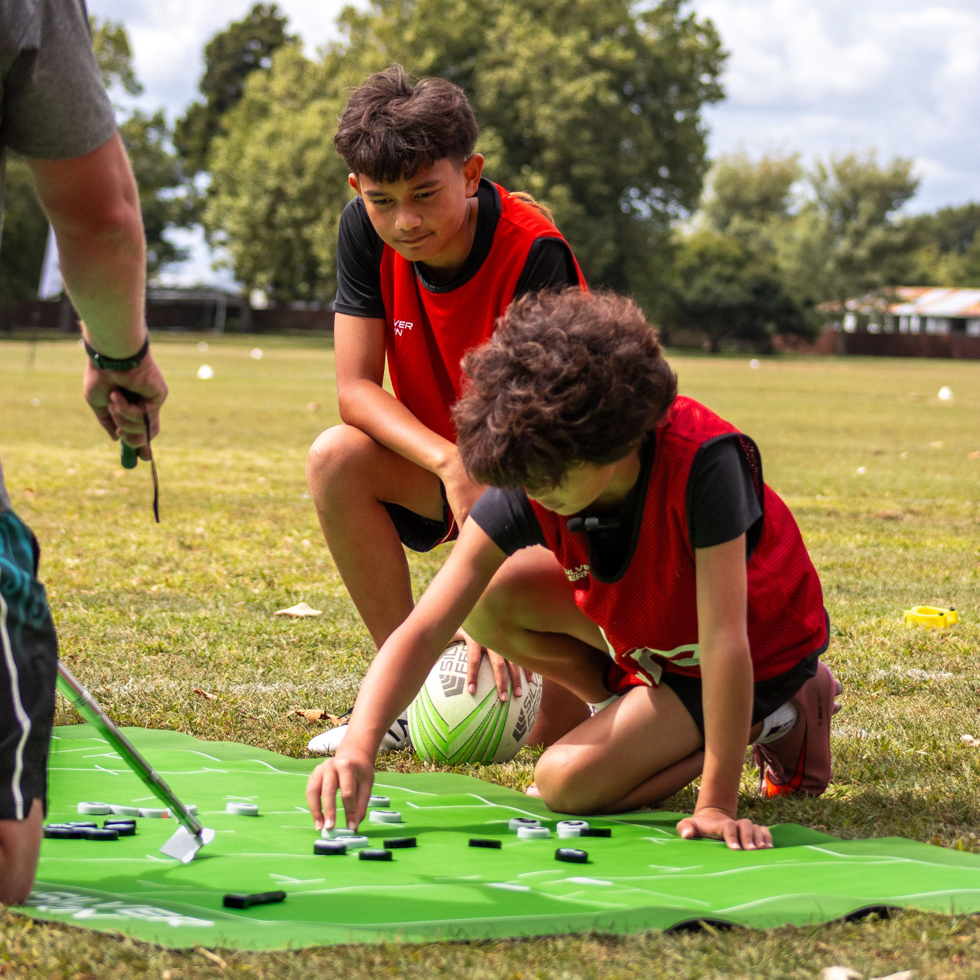 Silver Fern Rugby Union Coaching Mat, lifestyle shot, coach walking players through strategy