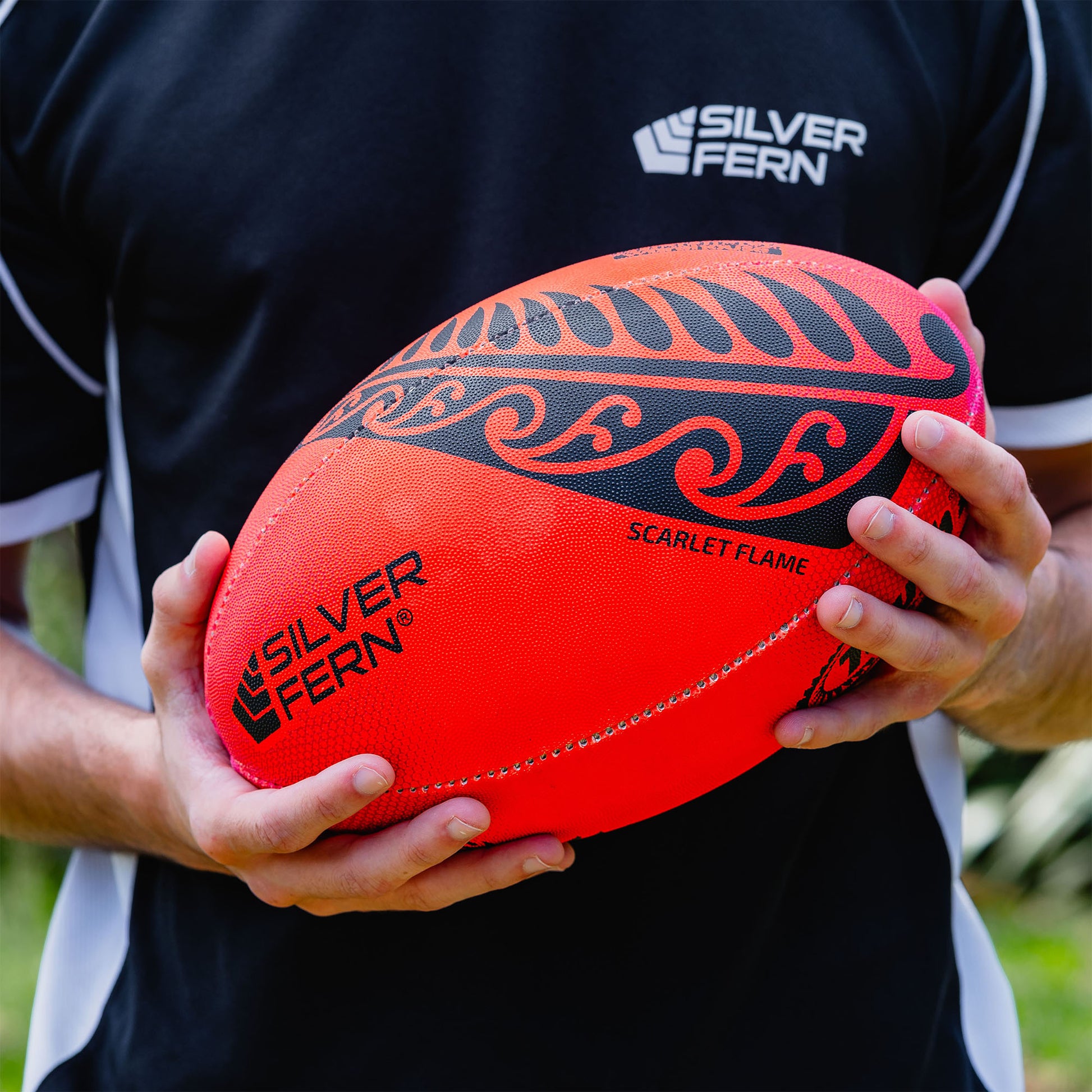 Scarlett Flame Red Touch Rugby Ball Lifestyle Image