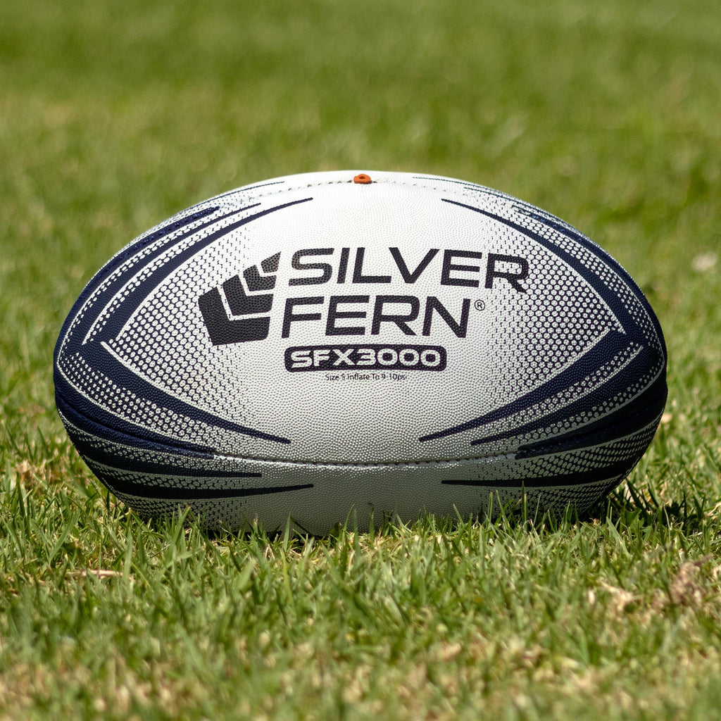 Silver Fern SFX Match Ball Size 5, Lifestyle shot, sitting on a rugby field