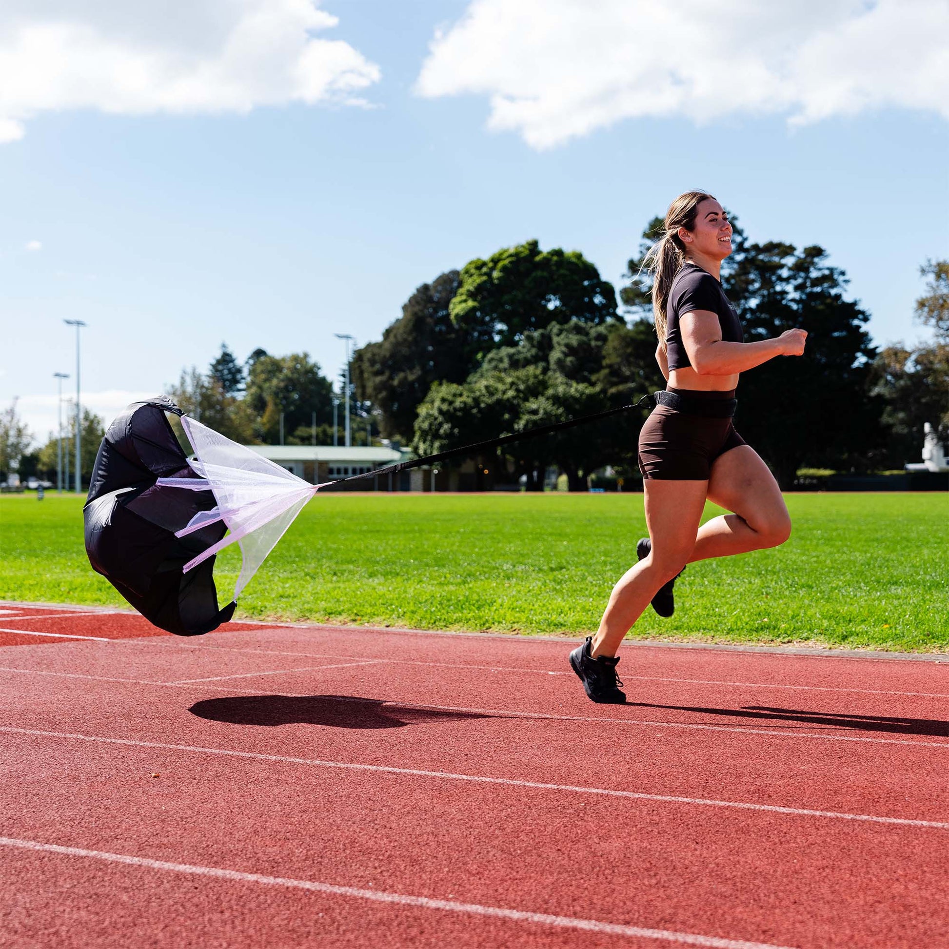 An Agility Speed Chute being used by an Athlete running, lifestyle shot.