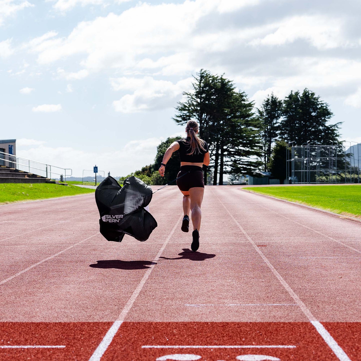 An Agility Speed Chute being used by an Athlete running, lifestyle shot.