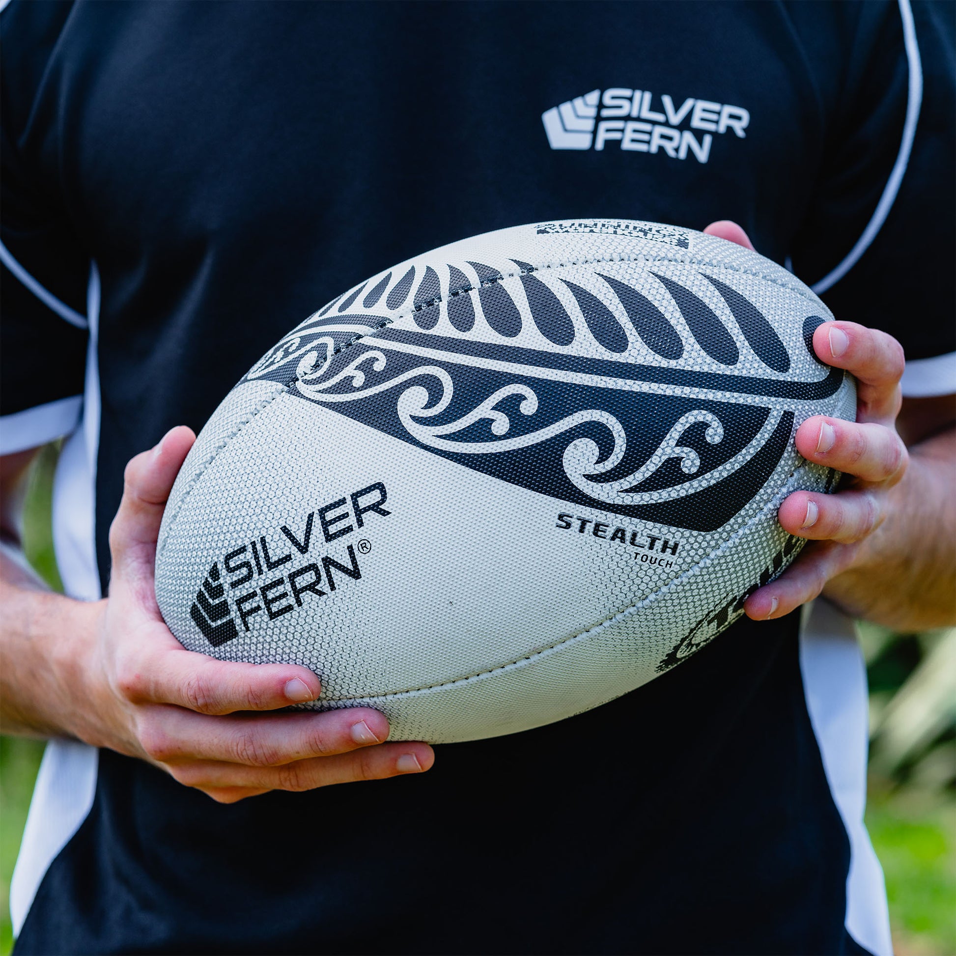 White and Black Stealth Match Touch Rugby Ball Lifestyle Image