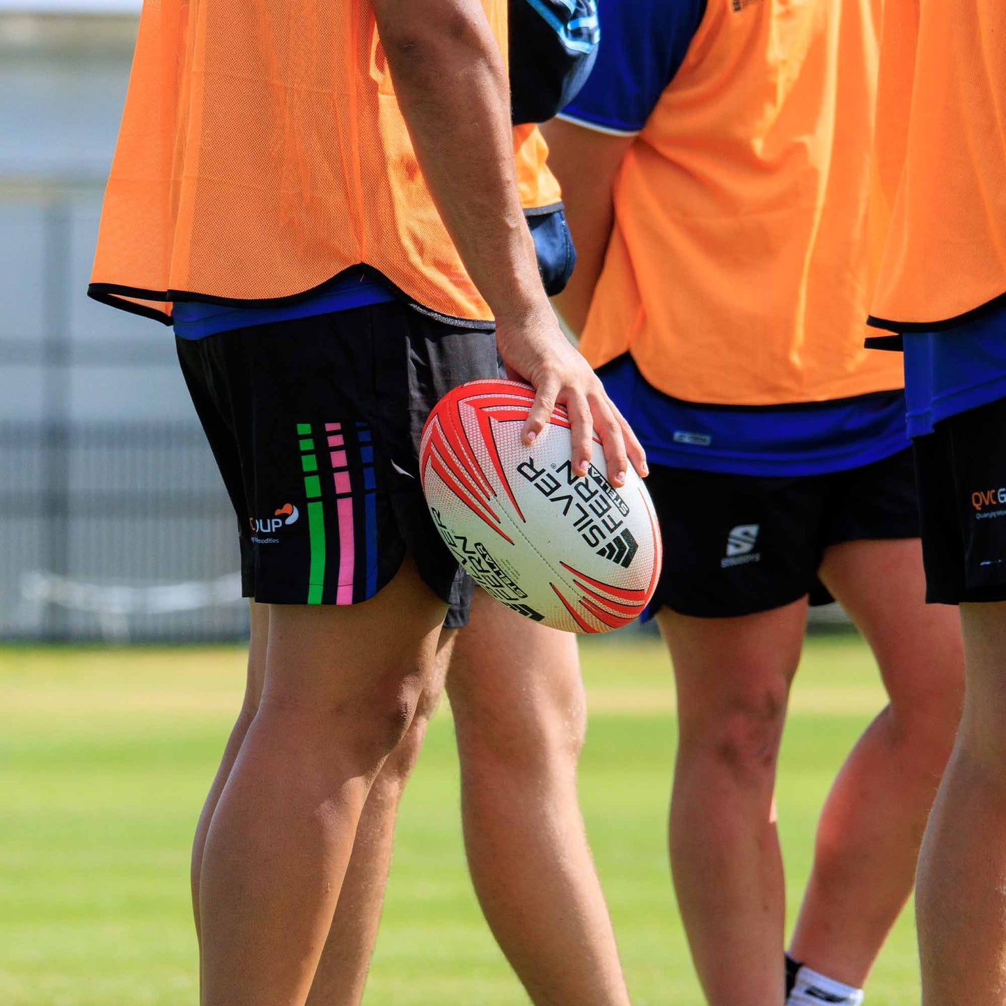 Silver Fern Rugby Premium Trainer Stellar Ball, Red, Size 5, player holding ball, lifestyle.