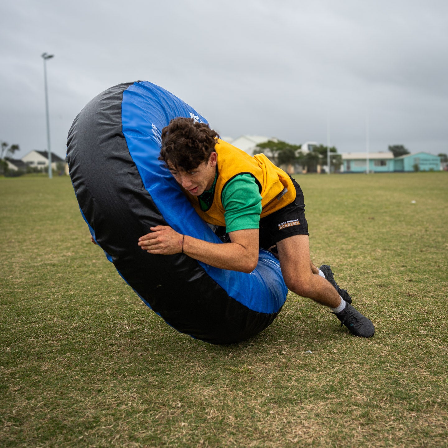 Silver Fern Tackle Tube, lifestyle shot, rugby player tackling the tackle tube.