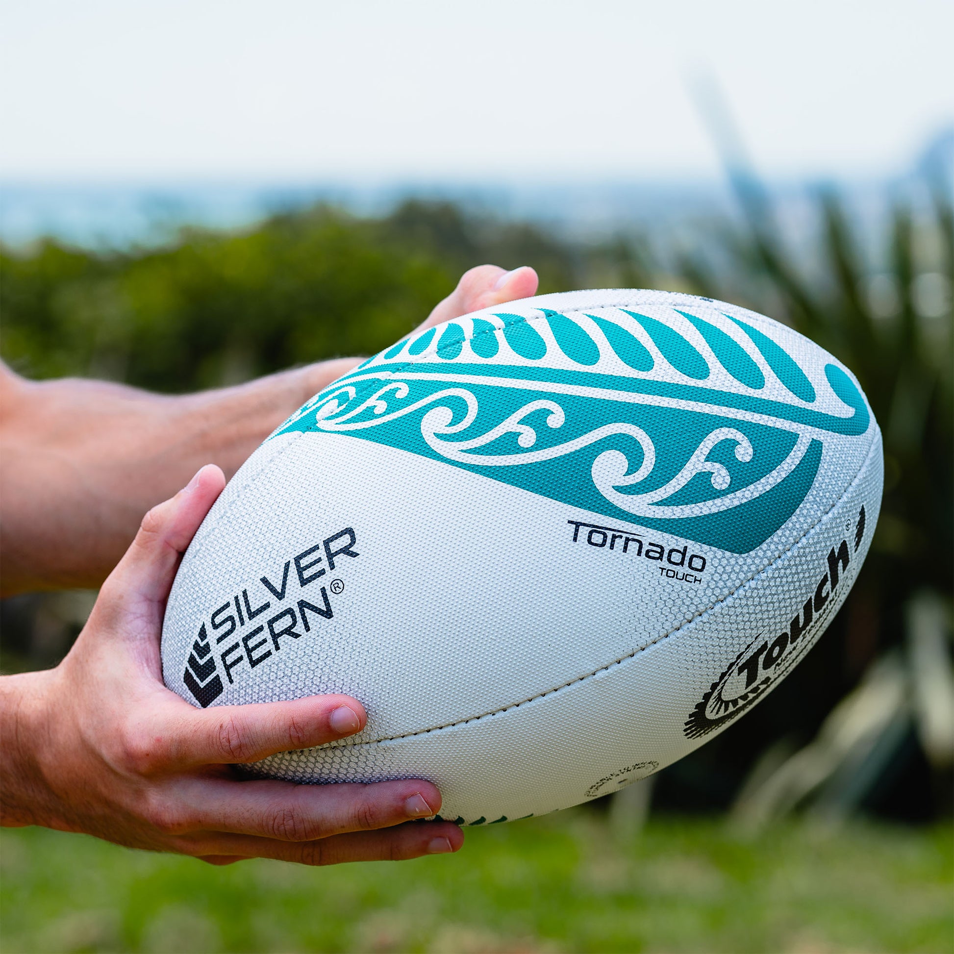 Green and White Match Touch Rugby Ball Lifestyle Image